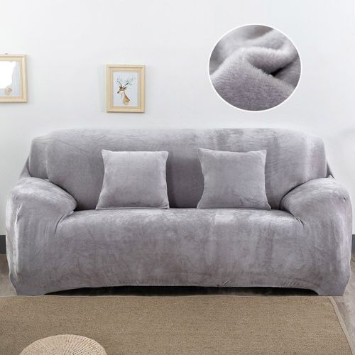 Housse de canapé en velours gris dans un salon lumineux